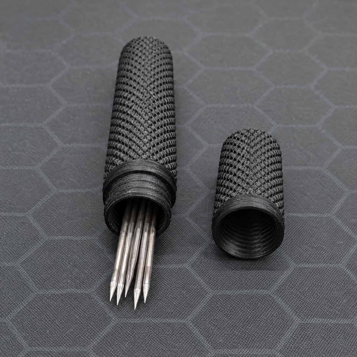 Open black tungsten electrode case with matching cap and example tungsten electrodes.