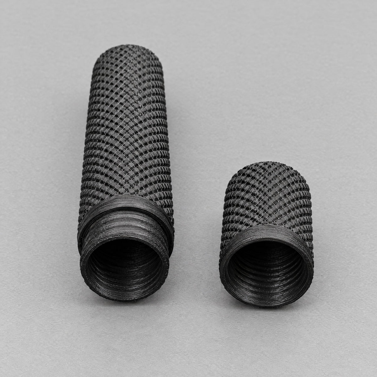 Open black tungsten electrode case and cap showing the threaded closure.